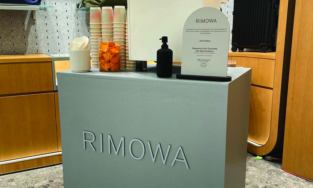 Woofys created bespoke silver coffee bar for the launch of the latest Rimowa papaya and mint colourway collection