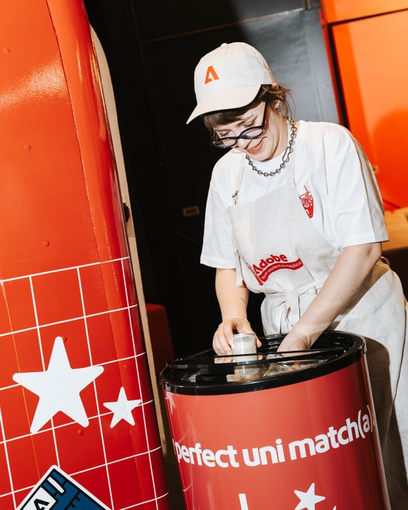 Barista serving matcha at an Adobe branded cart activation