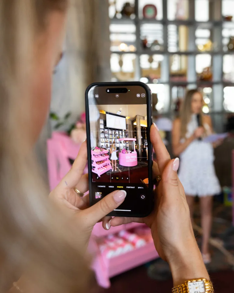 Guest photographing a pink activation set