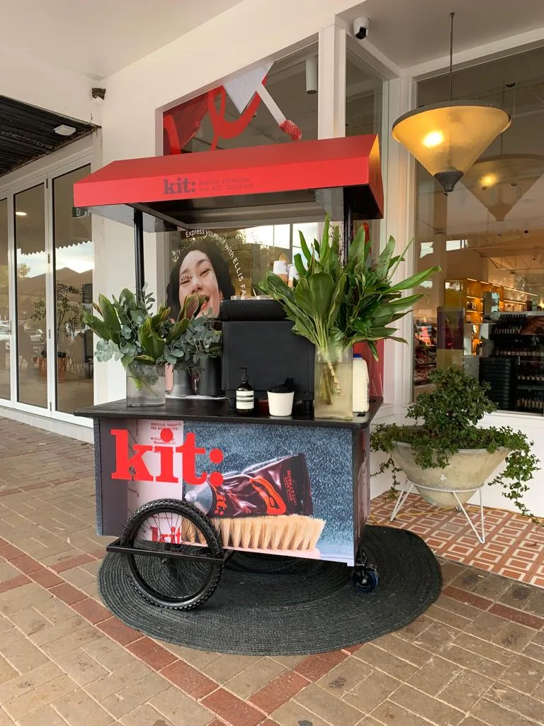 kit: branded coffee cart outside store